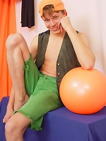 Playful straight boy Walter poses with orange ball